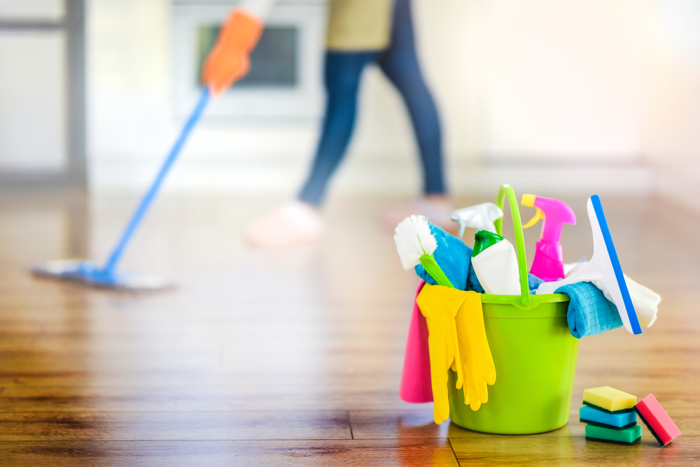 Expert maid efficiently organizing and cleaning a Riviera Beach household with professional grade equipment