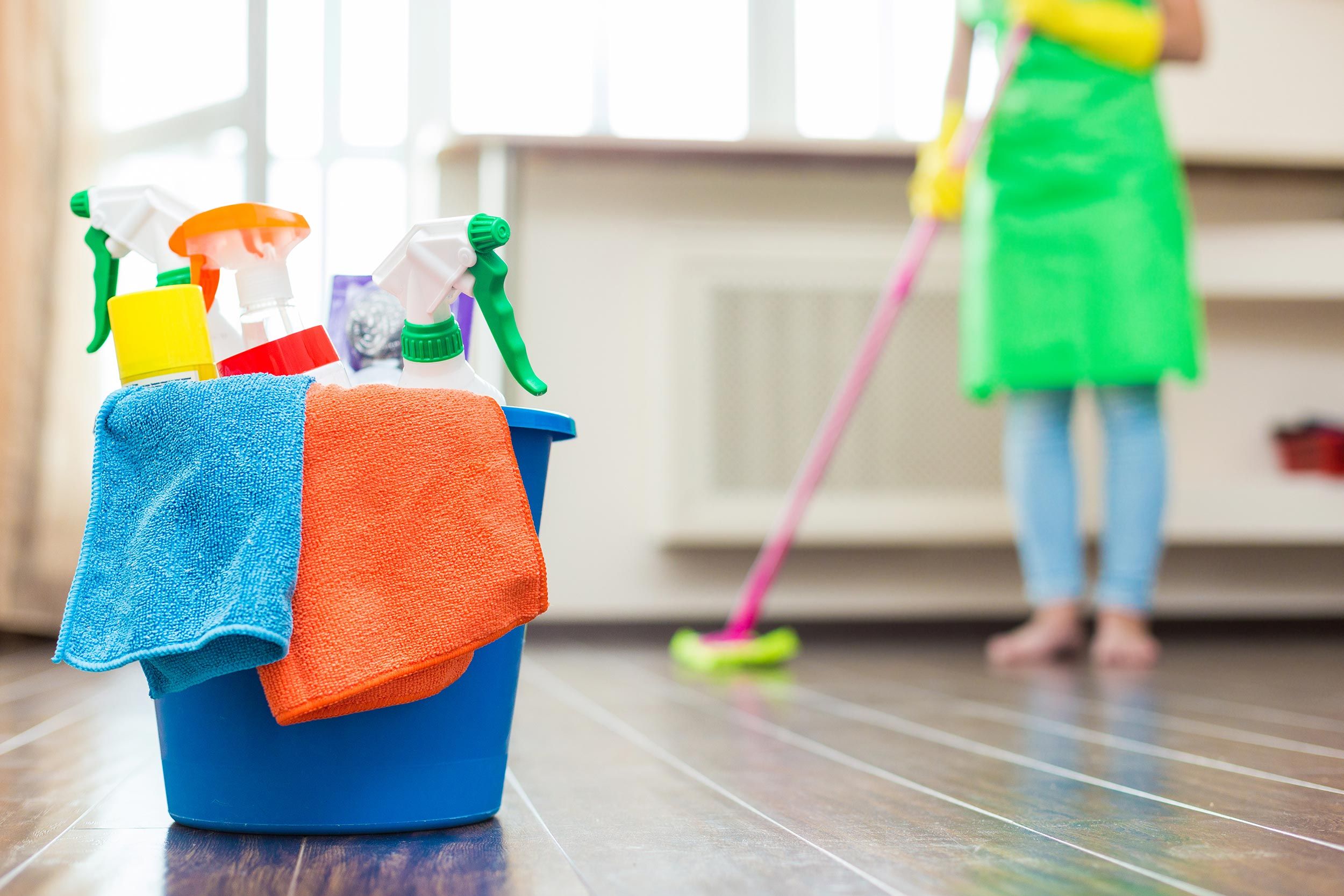Professional maid service team diligently cleaning a home, ensuring every corner is perfectly polished