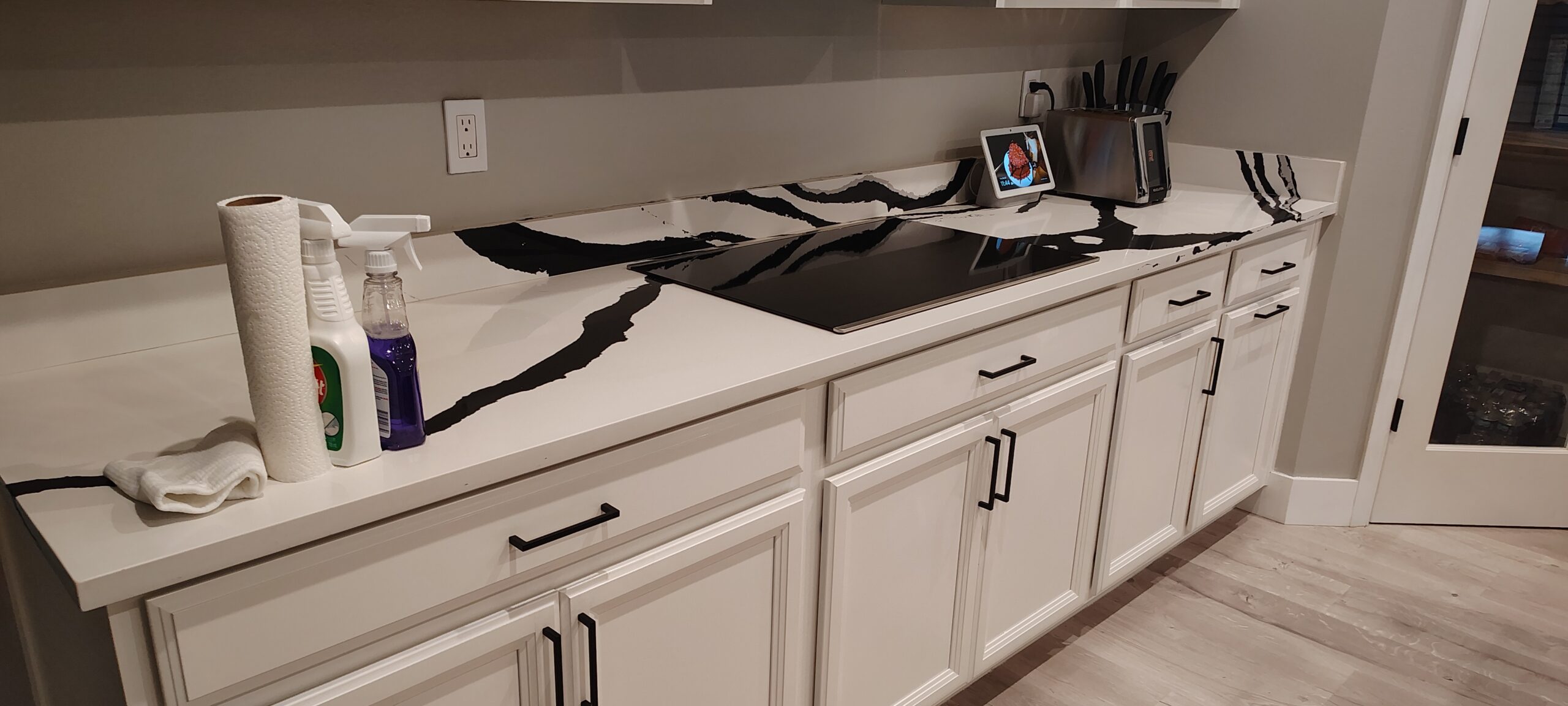 Experienced cleaner inspecting detailed surfaces and sanitizing high-touch areas with professional tools