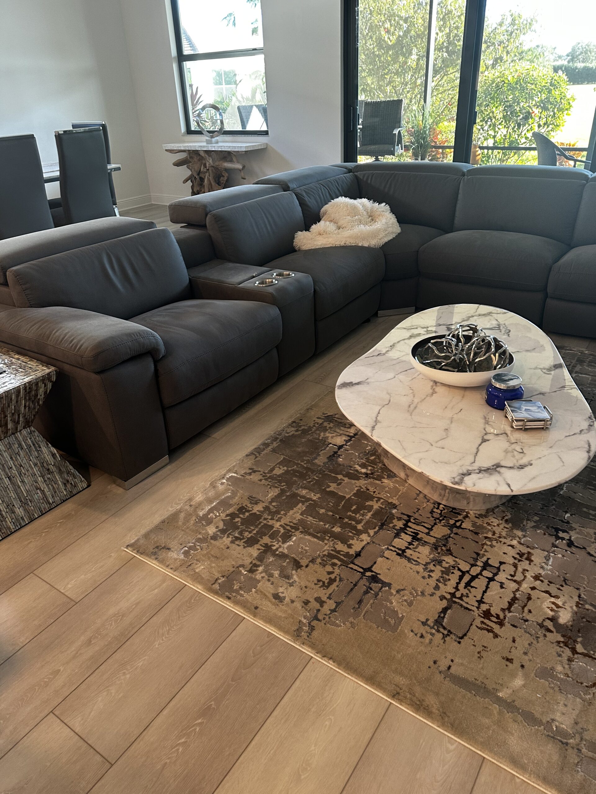Cleaner scrubbing empty kitchen cabinets during a move out cleaning in Palm Beach Gardens home